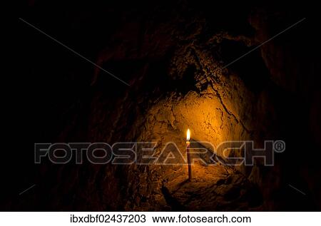 Stock Image - "Burning candle, Buddha Cave, Mae Cham, Chiang Rai Province, Northern Thailand, Thailand, Asia". Fotosearch