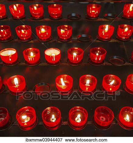 Stock Photo - "Burning votive candles in a church, Munich, Upper Bavaria, Bavaria, Germany, Europe". Fotosearch