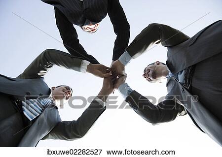 Business team joining hands to celebrate their success View Large Photo Image Stock Photo - Business team joining hands to celebrate their success. Fotosearch