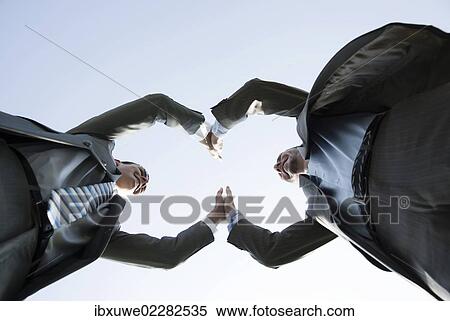 Business team joining hands to celebrate their success View Large Photo Image Stock Photography - Business team joining hands to celebrate their success. Fotosearch