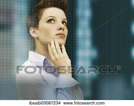 Business woman with a punk hairstyle in front of a stock exchange board View Large Photo Image Picture - Business woman with a punk hairstyle in front of a stock exchange board. Fotosearch