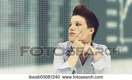 Business woman with a punk hairstyle in front of a stock exchange board View Large Photo Image Stock Image - Business woman with a punk hairstyle in front of a stock exchange board. Fotosearch