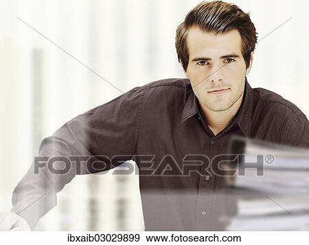 Businessman in office View Large Photo Image Stock Photo - Businessman in office. Fotosearch