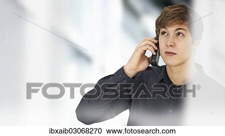 Businessman making a phone call in an office View Large Photo Image Stock Image - Businessman making a phone call in an office. Fotosearch