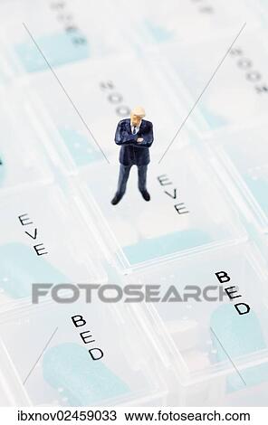 Businessman miniature figurine on pill box View Large Photo Image Stock Image - Businessman miniature figurine on pill box. Fotosearch