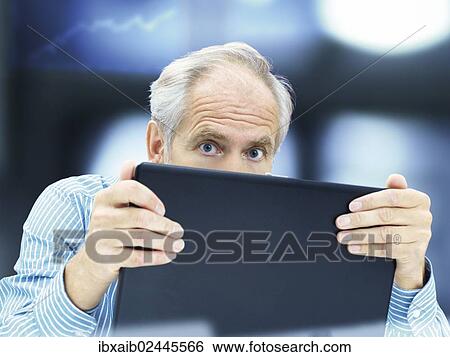 "Businessman, senior, boss, retiree, professor, teacher, behind a laptop with a stressed expression" View Large Photo Image Stock Photograph - "Businessman, senior, boss, retiree, professor, teacher, behind a laptop with a stressed expression". Fotosearch