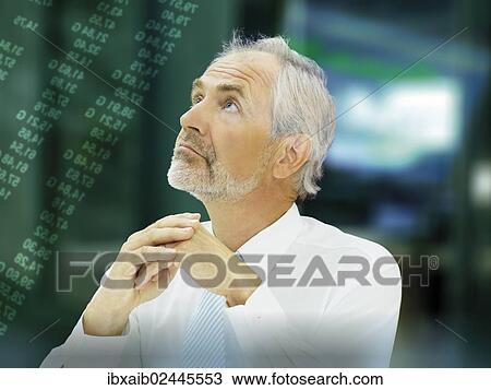Stock Image - "Businessman, senior, thoughtful or worried expression at the stock exchange". Fotosearch