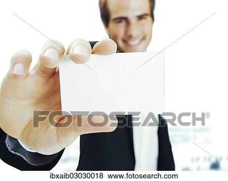 Businessman showing blank business card View Large Photo Image Stock Photo - Businessman showing blank business card. Fotosearch
