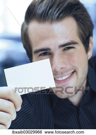 Businessman showing blank business card View Large Photo Image Stock Photograph - Businessman showing blank business card. Fotosearch