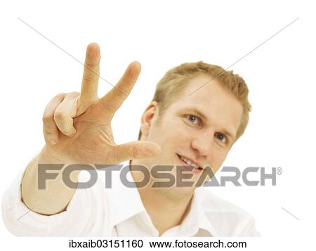 Businessman showing three fingers View Large Photo Image Stock Image - Businessman showing three fingers. Fotosearch