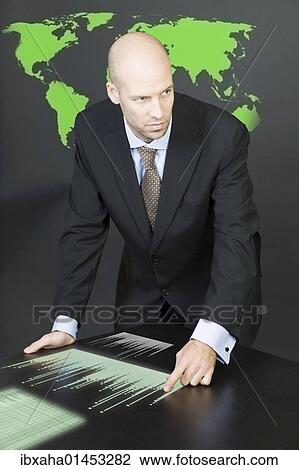 Businessman thinking strategically about sales and globalization View Large Photo Image Stock Image - Businessman thinking strategically about sales and globalization. Fotosearch