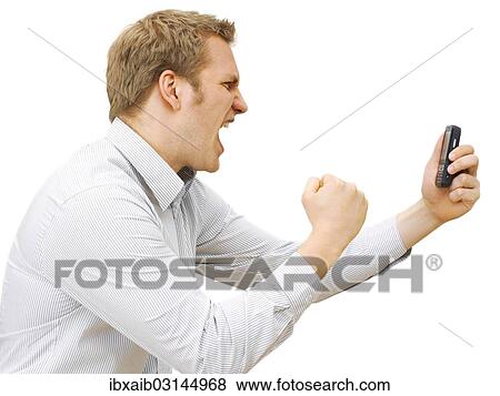 "Businessman using a mobile phone, stressed, angry" View Large Photo Image Stock Photo - "Businessman using a mobile phone, stressed, angry". Fotosearch