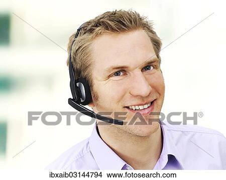 Businessman wearing a headset View Large Photo Image Picture - Businessman wearing a headset. Fotosearch