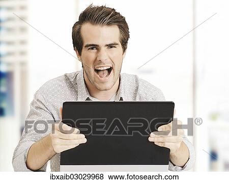 "Businessman with laptop, screaming with joy" View Large Photo Image Stock Photo - "Businessman with laptop, screaming with joy". Fotosearch