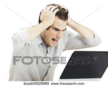 "Businessman with laptop, tearing his hair in despair" View Large Photo Image Stock Photo - "Businessman with laptop, tearing his hair in despair". Fotosearch