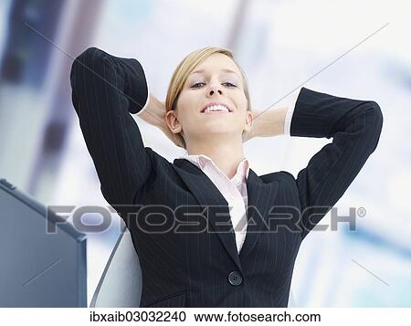 "Businesswoman at the office, relaxed" View Large Photo Image Stock Image - "Businesswoman at the office, relaxed". Fotosearch