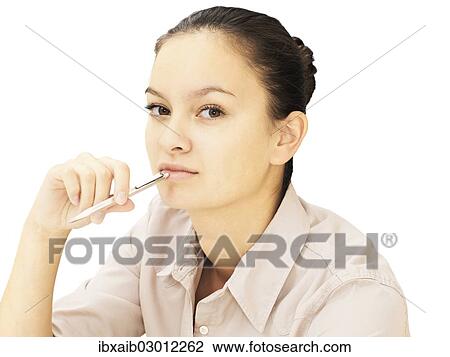 Businesswoman holding a pen View Large Photo Image Stock Image - Businesswoman holding a pen. Fotosearch
