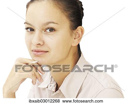 Businesswoman holding a pen View Large Photo Image Stock Photo - Businesswoman holding a pen. Fotosearch
