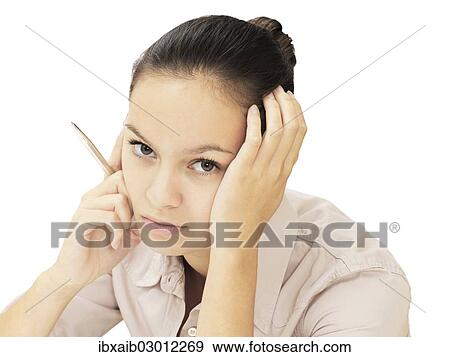 Businesswoman holding a pen View Large Photo Image Stock Photo - Businesswoman holding a pen. Fotosearch