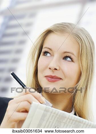 Businesswoman in an office View Large Photo Image Picture - Businesswoman in an office. Fotosearch