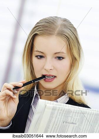 Businesswoman in an office View Large Photo Image Picture - Businesswoman in an office. Fotosearch