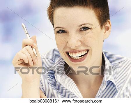 "Businesswoman in an office, smiling" View Large Photo Image Stock Photo - "Businesswoman in an office, smiling". Fotosearch