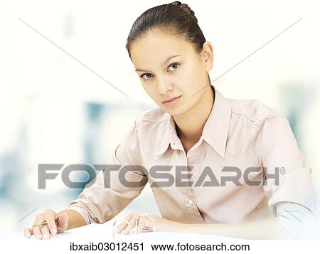 Businesswoman in an office View Large Photo Image Stock Image - Businesswoman in an office. Fotosearch