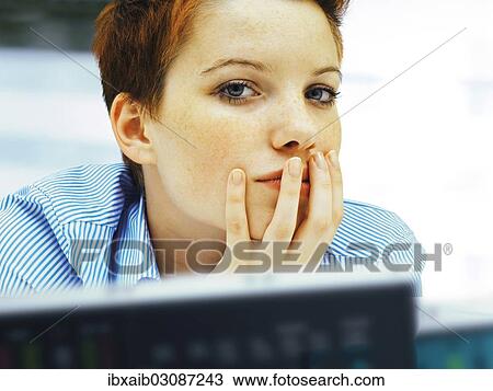 "Businesswoman in an office, concentrating" View Large Photo Image Stock Image - "Businesswoman in an office, concentrating". Fotosearch