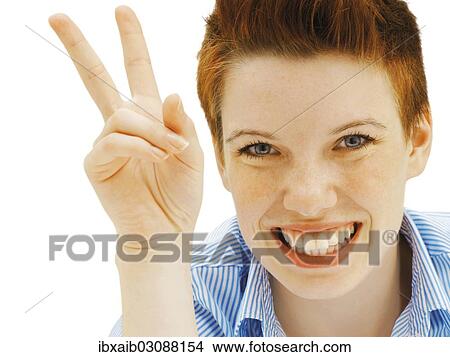 Businesswoman making a V-sign View Large Photo Image Picture - Businesswoman making a V-sign. Fotosearch