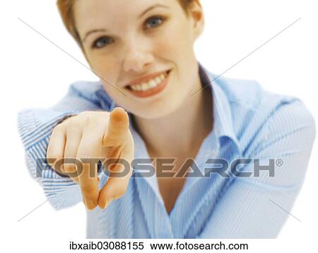 Stock Photography - Businesswoman pointing forward with her finger. Fotosearch