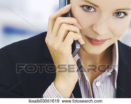 Businesswoman using a phone View Large Photo Image Stock Photo - Businesswoman using a phone. Fotosearch