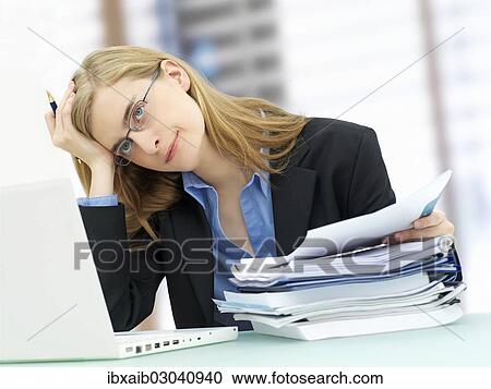 "Businesswoman wearing glasses and using a laptop, accounting" View Large Photo Image Stock Image - "Businesswoman wearing glasses and using a laptop, accounting". Fotosearch