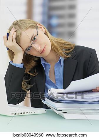 "Businesswoman wearing glasses and using a laptop, accounting" View Large Photo Image Stock Image - "Businesswoman wearing glasses and using a laptop, accounting". Fotosearch