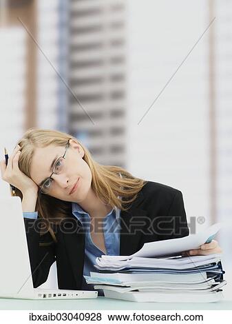 "Businesswoman wearing glasses and using a laptop, accounting" View Large Photo Image Stock Photo - "Businesswoman wearing glasses and using a laptop, accounting". Fotosearch