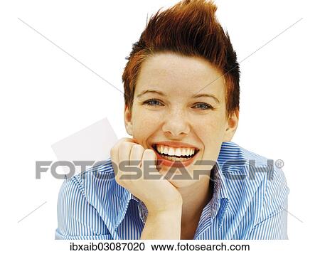 Businesswoman with a punk hairstyle holding a blank business card View Large Photo Image Stock Image - Businesswoman with a punk hairstyle holding a blank business card. Fotosearch