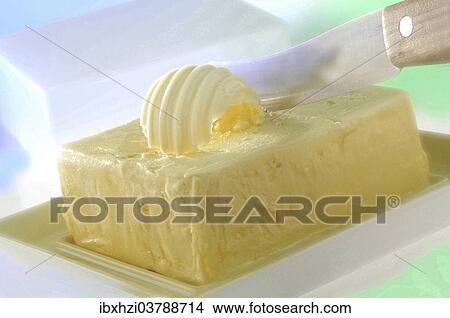 Butter with a butter knife and butter flake View Large Photo Image Picture - Butter with a butter knife and butter flake. Fotosearch