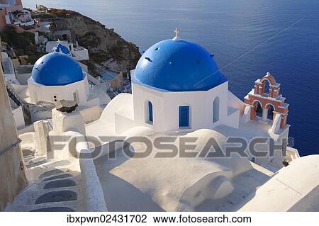 Stock Image - "Byzantine Orthodox churches with blue domes, Oia, Ia, Santorini, Cyclades, Greece, Europe". Fotosearch