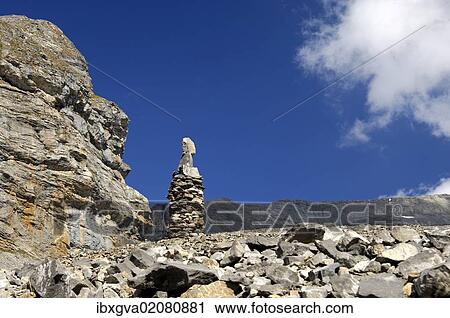 "Cairn as signpost and orientation help in rocky alpine terrain without trails, Valais, Switzerland, Europe" View Large Photo Image Stock Image - "Cairn as signpost and orientation help in rocky alpine terrain without trails, Valais, Switzerland, Europe". Fotosearch