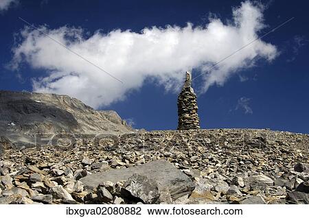 "Cairn as signpost and orientation help in rocky alpine terrain without trails, Valais, Switzerland, Europe" View Large Photo Image Stock Image - "Cairn as signpost and orientation help in rocky alpine terrain without trails, Valais, Switzerland, Europe". Fotosearch