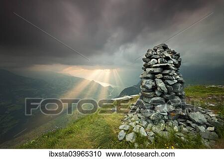 "Cairn, dusk with storm clouds, Alvier, Gonzen, Canton of St. Gallen, Switzerland, Europe" View Large Photo Image Stock Image - "Cairn, dusk with storm clouds, Alvier, Gonzen, Canton of St. Gallen, Switzerland, Europe". Fotosearch