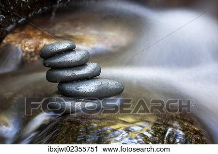 "Cairn, stack of basalt rocks in a mountain stream" View Large Photo Image Stock Image - "Cairn, stack of basalt rocks in a mountain stream". Fotosearch