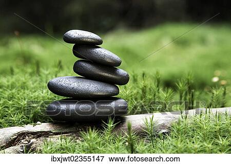 "Cairn, stack of basalt rocks, in a forest surrounded by moss" View Large Photo Image Stock Photo - "Cairn, stack of basalt rocks, in a forest surrounded by moss". Fotosearch