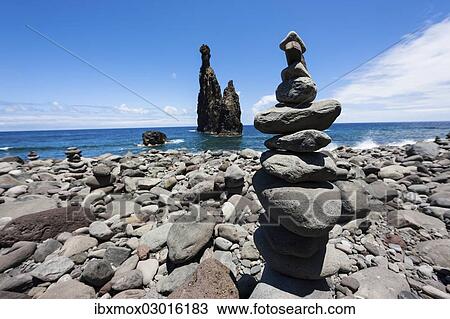 "Cairns built as good luck charms at the Ilheus da Rib rock formation, on the cliff coast of Ribeira da Janela, Lanceiros, Ribeira da Janela, Madeira, Portugal, Europe" View Large Photo Image Stock Image - "Cairns built as good luck charms at the Ilheus da Rib rock formation, on the cliff coast of Ribeira da Janela, Lanceiros, Ribeira da Janela, Madeira, Portugal, Europe". Fotosearch