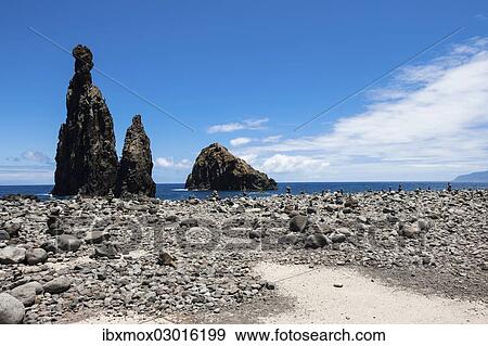 "Cairns built as good luck charms at the Ilheus da Rib rock formation, on the cliff coast of Ribeira da Janela, Lanceiros, Ribeira da Janela, Madeira, Portugal, Europe" View Large Photo Image Stock Photo - "Cairns built as good luck charms at the Ilheus da Rib rock formation, on the cliff coast of Ribeira da Janela, Lanceiros, Ribeira da Janela, Madeira, Portugal, Europe". Fotosearch