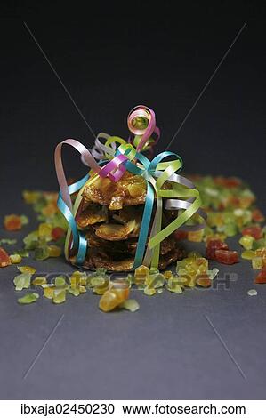 Candied orange peel and biscuits wrapped with a ribbon View Large Photo Image Stock Image - Candied orange peel and biscuits wrapped with a ribbon. Fotosearch