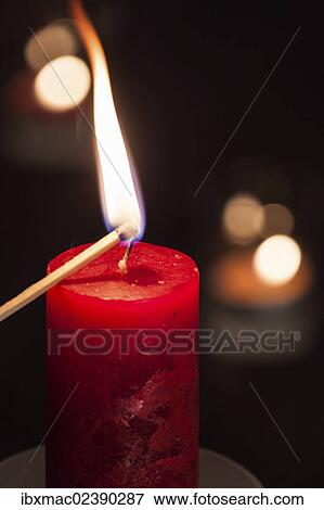Candle being lit with a match View Large Photo Image Stock Photo - Candle being lit with a match. Fotosearch