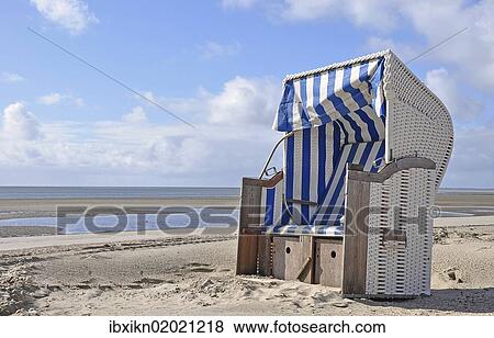 "Canopied beach chair on the North Sea coast, Wyk auf Foehr, Schleswig-Holstein, Germany, Europe" View Large Photo Image Stock Photo - "Canopied beach chair on the North Sea coast, Wyk auf Foehr, Schleswig-Holstein, Germany, Europe". Fotosearch