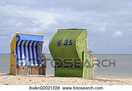 "Canopied beach chairs on the North Sea coast, Wyk auf Foehr, Schleswig-Holstein, Germany, Europe" View Large Photo Image Stock Photo - "Canopied beach chairs on the North Sea coast, Wyk auf Foehr, Schleswig-Holstein, Germany, Europe". Fotosearch
