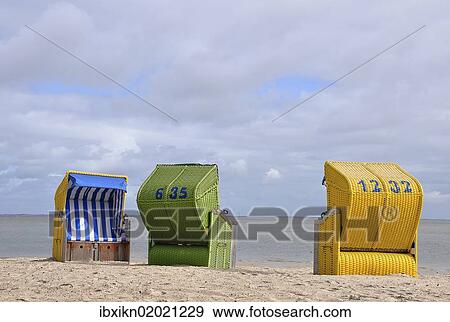 "Canopied beach chairs on the North Sea coast, Wyk auf Foehr, Schleswig-Holstein, Germany, Europe" View Large Photo Image Stock Photo - "Canopied beach chairs on the North Sea coast, Wyk auf Foehr, Schleswig-Holstein, Germany, Europe". Fotosearch