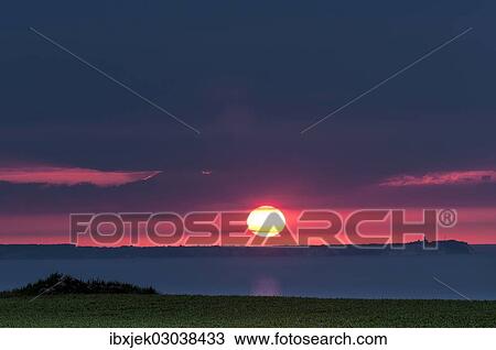 Stock Image - "Cape Arkona with Lighthouse at sunset, nahe Lohme, Rugen island, Rugen, Mecklenburg-Western Pomerania, Germany, Europe". Fotosearch